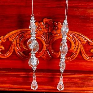 2 beautiful, ornate, crystal-looking plastic icicle ornaments.